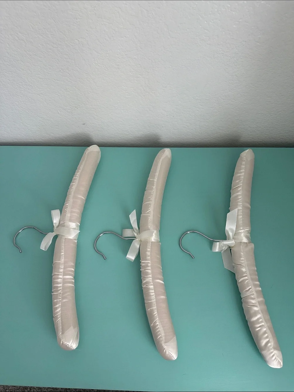 Satin padded heavy duty hangers-set of 3ct.-glossy ivory color & silver hook-new